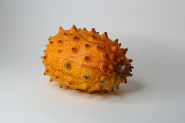 kiwano fruit, Also called African Horned Cucumber or Jelly Melon, the grapefruit size oval melon with horn like spines has a yellow orange skin with lime green jelly-like flesh. 
