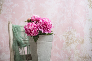 Bouquet of Pink Peonies in a Metal Container on Vintage Background