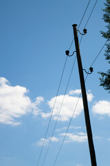 Communications pole with cables and holders