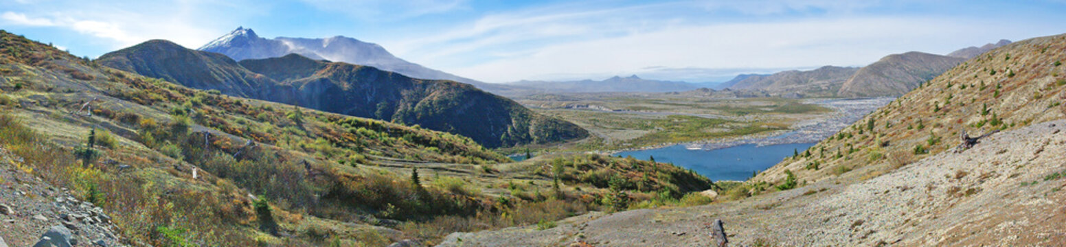 A panoramic image of Mt St Helens volcano, the surrounding landscape and a portion of Spirit Lake - 34 years after the eruption