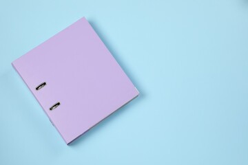 One office folder on light blue background, top view. Space for text