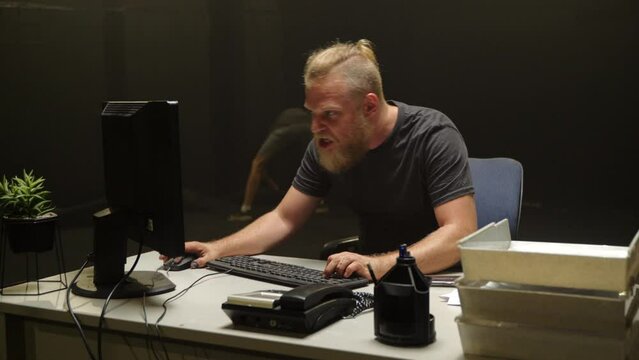 Male adult rage at the computer - going mad -  angry and furious gamer, acting insane.