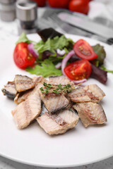 Delicious canned mackerel chunks served on white table, closeup