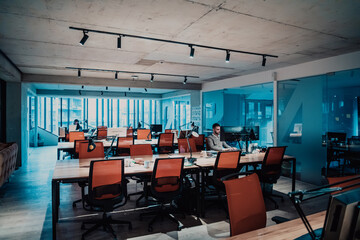 Modern Office: Portrait of Stylish Businessman Works on Computer, Does Data Analysis and Creative Designer, Looks at Camera and Smiles. Digital Entrepreneur Works on e-Commerce Startup Project