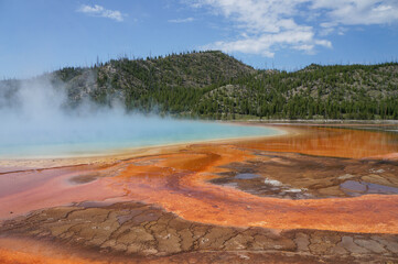 Geyser in red hot spring from Yellowstone National Park 