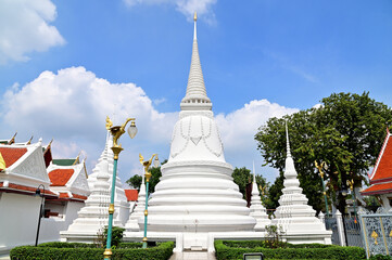 White Pagoda with blue sky and white cloud background at Buddha temple,Thailand.