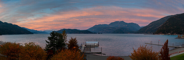 Panoramic Sunset View of Harrison Lake, British Columbia, Canada. Harrison Lake is the largest lake in the southern Coast Mountains of Canada. Seen from the Harrison Hot Springs Resort.