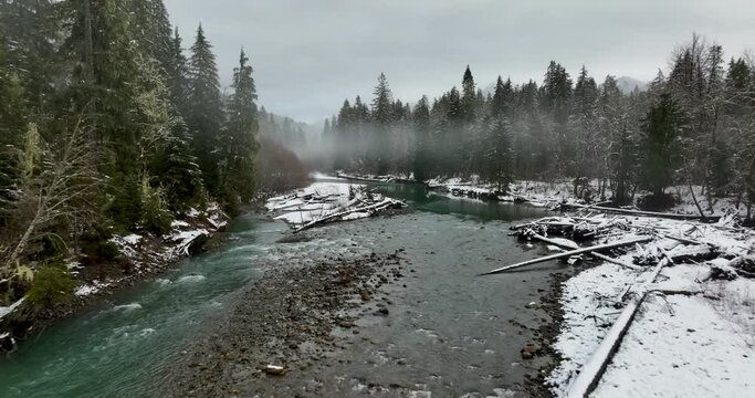 Flying Aerial Above Stillaguamish River Washington USA Covered in Fresh Snow From Winter Storm
