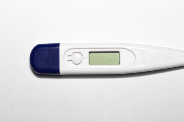 Selective focus, shallow depth of field and close up of part of digital thermometer measuring human...