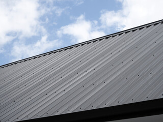Fototapeta na wymiar Close-up view of gray metal roof