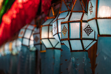 Colorful lanterns Hanging on a wire in the temple of Lamphun, Thailand in the Lantern Festival.