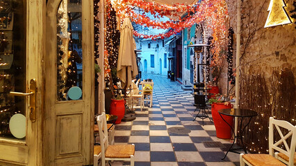 xmas season street cafe in ioannina city greece lights tables chairs pedestrian street like chessboard