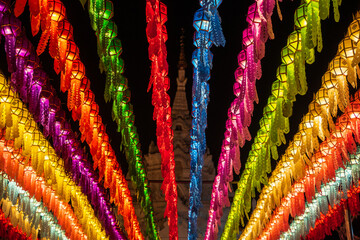 Colorful lanterns Hanging on a wire in the temple of Lamphun, Thailand in the Lantern Festival.
