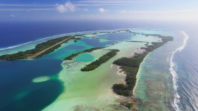 Aerial shot of Palmyra Atoll, reef, lagoon and tropical islands.