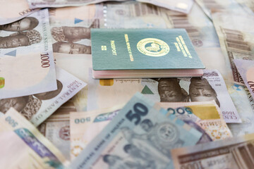 Nigerian Ecowas Passport on top of Nigerian Naira