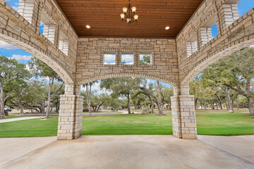 Large home with an arched driveway