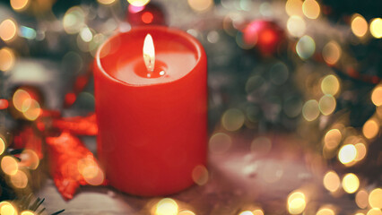 Obraz na płótnie Canvas closeup.candle and Christmas wreath on wooden background