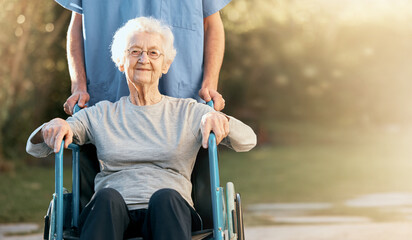 Healthcare, portrait and old woman in wheelchair with nurse in nature for wellness. Outdoors,...