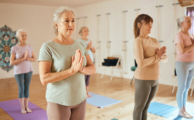Yoga, meditation and fitness with a senior woman in an exercise class for holistic wellness or...