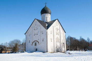 Fototapeta na wymiar Medieval Church of the Transfiguration of the Savior (1374) close-up on a sunny March day. Veliky Novgorod, Russia