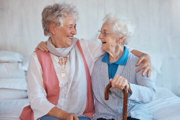 Senior woman, friends and embrace on bed in house, apartment or nursing home with happiness....