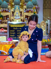 Asian mother and son of Thai nationality in temple at Thung Saliam temple or 