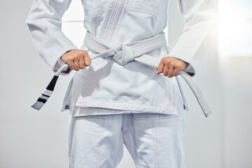 karate belt, martial arts and woman ready for fight battle, white dojo training or fitness...