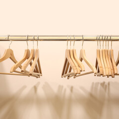 Wooden coat hangers for clothes hanging on bar