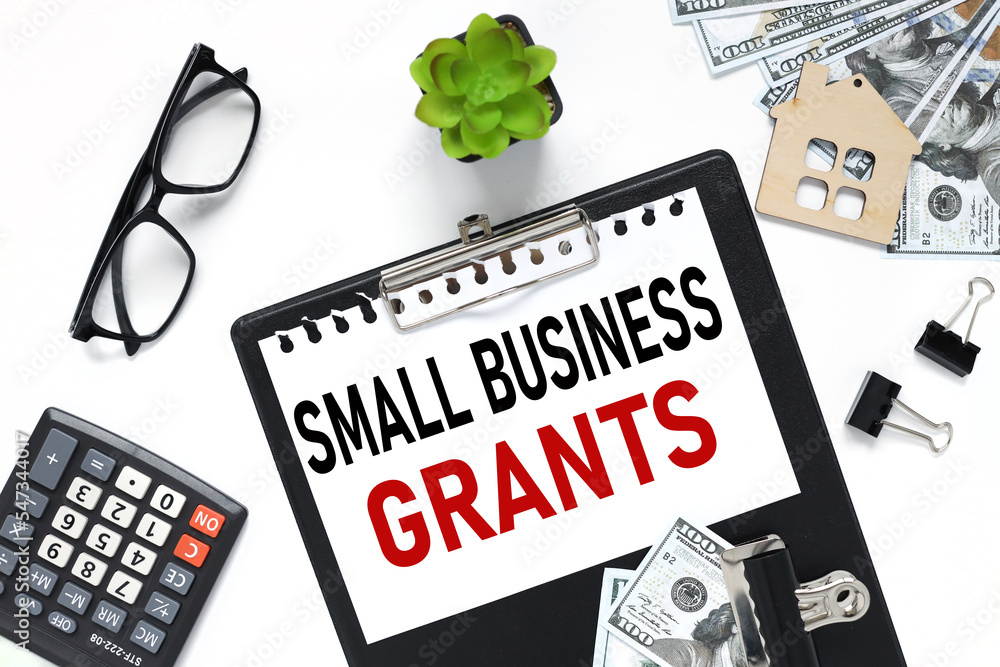 Poster small business grants. text on folder with closed top view