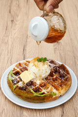 Trio waffle with homemade vanilla ice cream, butter, crumble and maple syrup