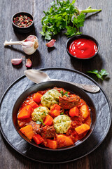 Beef Stew with Dumplings in bowl, top view