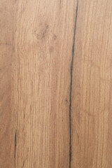 The wood texture of the cabinet lining is pale in color. With patterns. Vertical shot