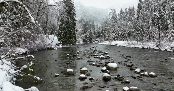 Snow Covered Rocks in a River Winter Weather in Stillaguamish Washington USA