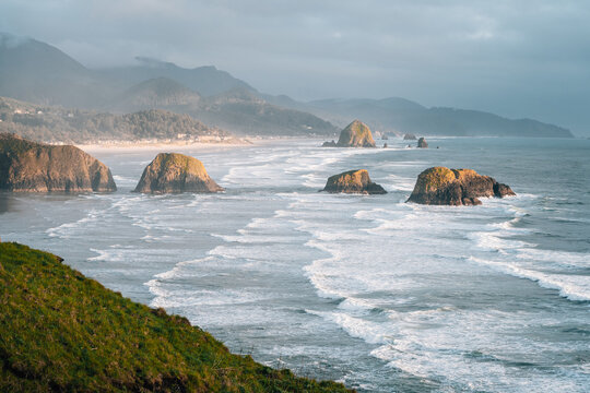 Enola State Park, Cannon Beach heystack rock reflects on the beach in oregon