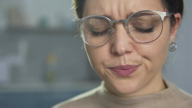 Confused frustrated woman taking some medicine feeling anxiety and apathy, antidepressants and psychotropic drugs, risk of addiction, close-up face, emergency situation