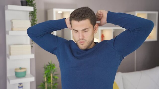 Underarm sweat smell.
The man with sweaty armpits is disgusted by the smell and is uncomfortable.
