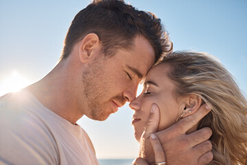 Couple, head touch and love at beach in closeup with romance, care and happiness for relationship....