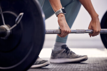 Fitness, exercise and strong, woman with barbell doing deadlift during workout and weight training for a healthy body. Sports model with a watch and weights for motivation, health and wellness