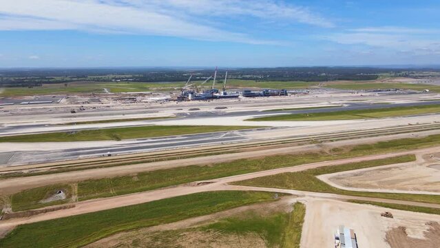 Aerial drone view of the construction site of the new Western Sydney International Airport at Badgerys Creek in Western Sydney, NSW, Australia approaching from the west side in November 2022    