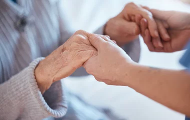 Foto op Plexiglas Oude deur Elderly woman hands, support and holding healthcare worker for medical care or help walking. Retirement care, senior person and holding hands for volunteer caregiver service in health community