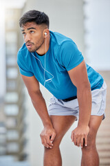 Tired, fitness and sweat with earphones music for cardio, workout and athletic training break....