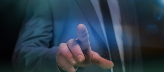 Businessman pointing or touching something, close-up of his hand.