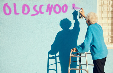 Senior woman, graffiti and wall with spray paint for street art in city, town or metro in retirement. Elderly rebel, painting or pop art in urban outdoor with vandalism, spray or painting in sunshine