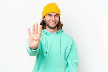 Young handsome man isolated on white chroma background happy and counting four with fingers