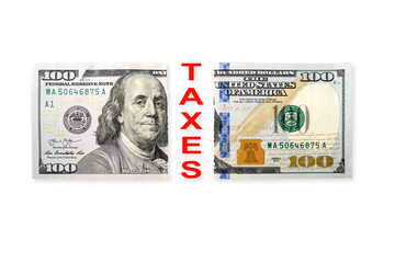 Top view of one hundred US dollars note with word TAXES