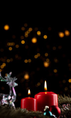 Two burning red candles on the New Year's table