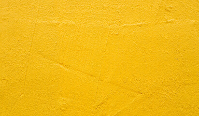 Rough blank wall painted by bright yellow paint as texture background or backdrop - 547364246