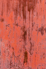  Red texture of metal sheet.Texture of the peeling paint on the sheet iron.Vertical photo