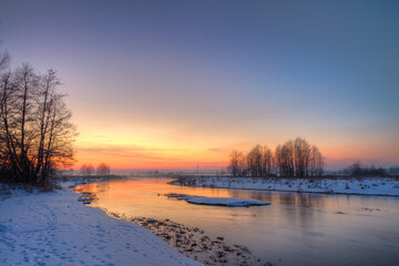 Winter landscape, amazing sundown in winter , Poland Europe, river valley Knyszyn Primeval Forest	