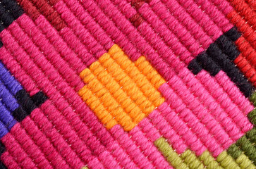 Macro texture fragment of hand embroidered fabric, background